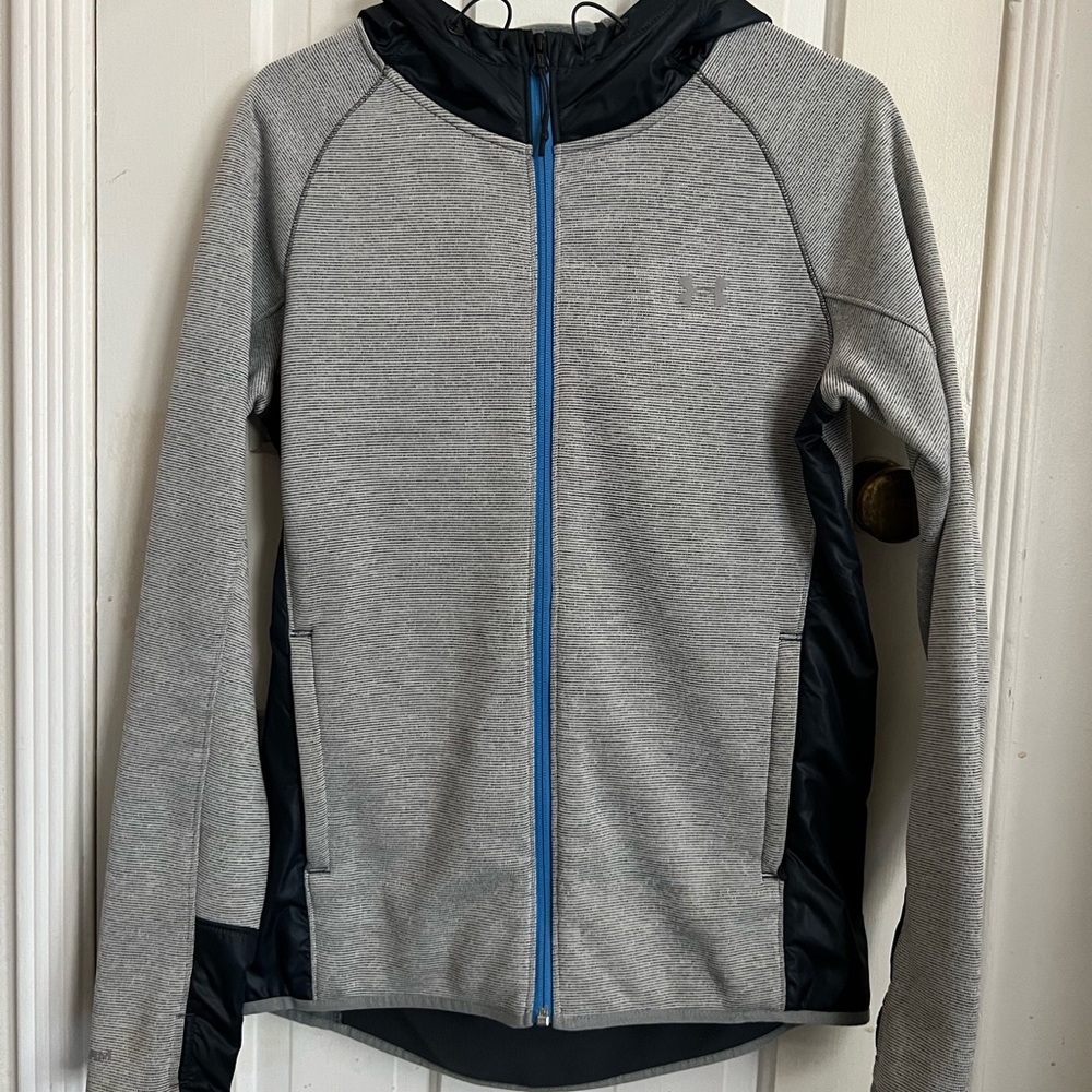 Under armor sports zip up jacket with different patterns and textures